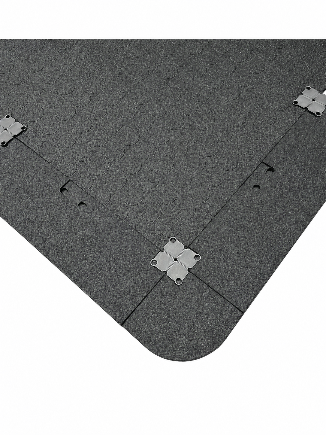 a rubber gym mat, it has ramps and a corner piece attached with plastic connectors